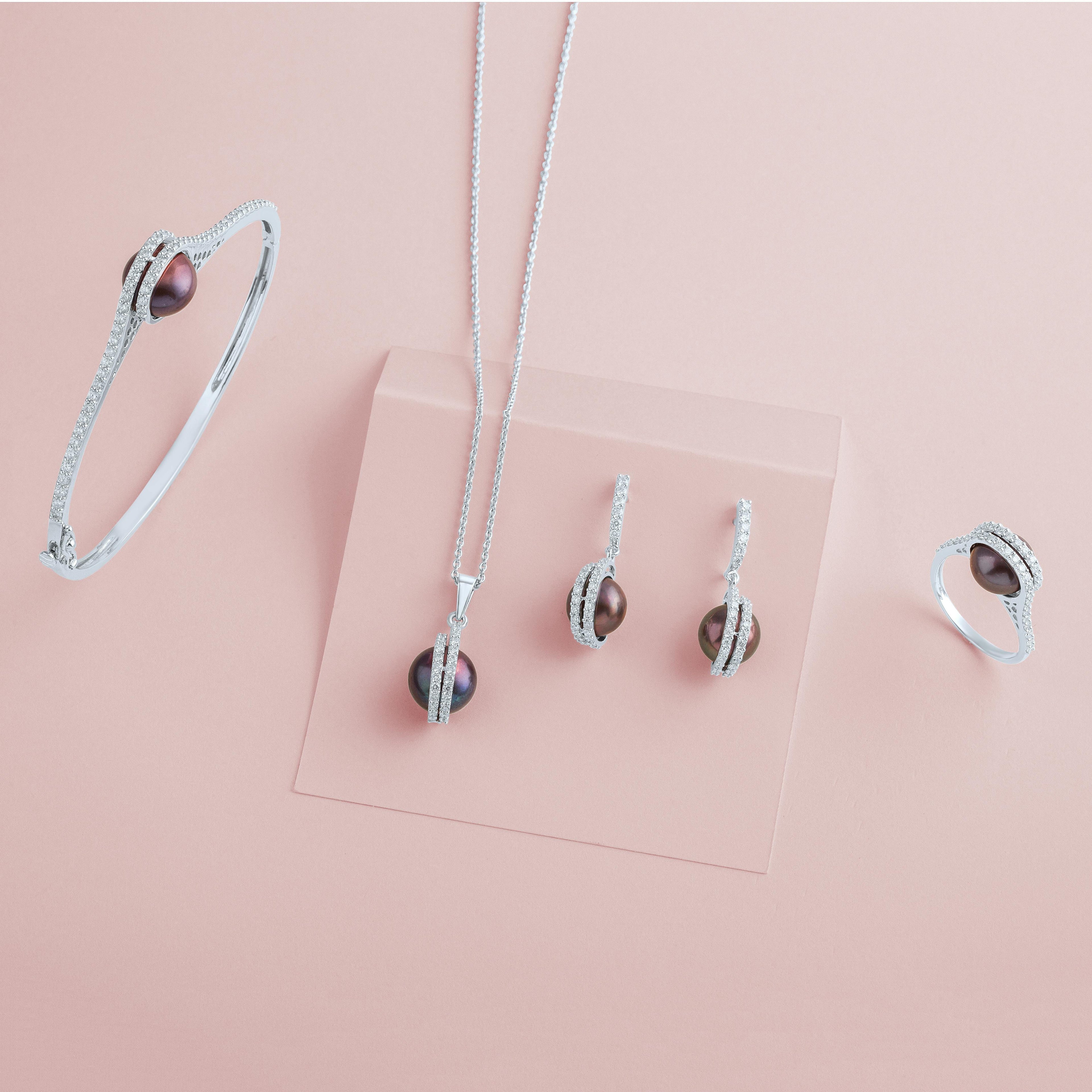 silver jewelry set with black pearls – elegant bracelet, necklace, ring, and earrings