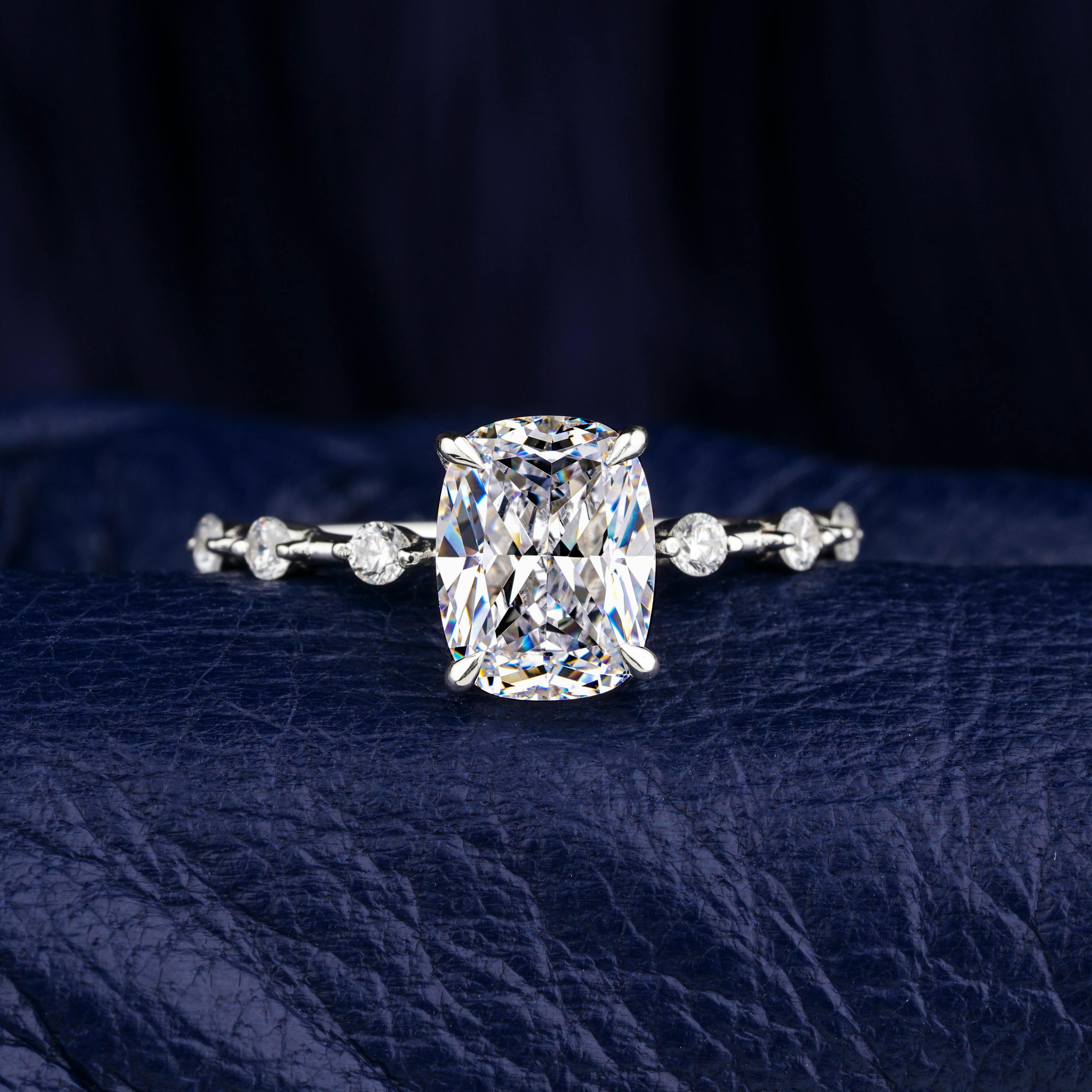 Close-up of handcrafted diamond engagement ring with gemstone accents